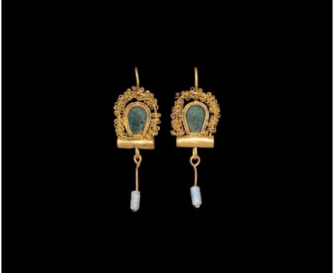 2nd-3rd century AD. A matched pair of gold earrings, each comprising a tongue-shaped plaque with beaded wire border and later