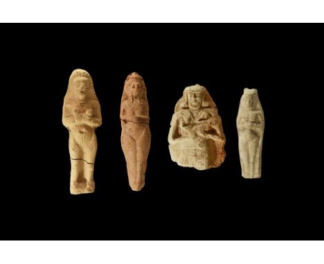 19th-18th century BC. A mixed group of ceramic figural plaques comprising: a terracotta nude female with hands clasped beneat