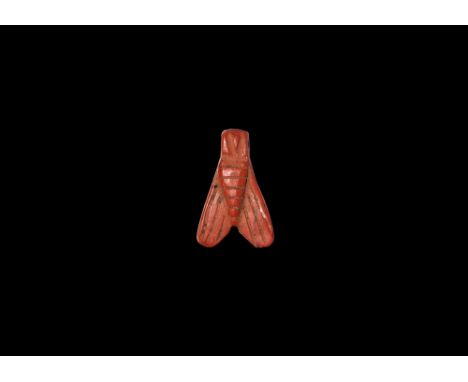 New Kingdom, 1550-1070 BC. A carved jasper amuletic pendant of a fly pierced at the head. Cf. Andrews, C. Amulets of Ancient 