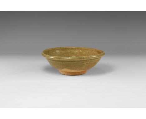 Song Dynasty, 960-1127 AD. A broad ceramic creamware bowl with basal ring and chamfered rim, centre unglazed.  384 grams, 16.
