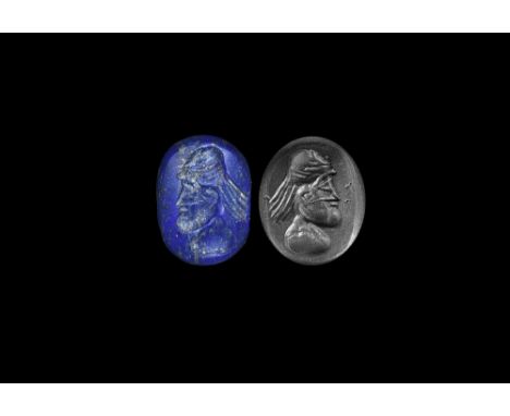 4th-6th century AD. A discoid lapis lazuli seal matrix with intaglio profile bust, bearded with cap and hair. Cf. Gyselen, R.
