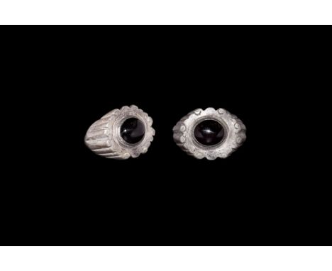 3rd century AD.A substantial D-section silver hoop with expanding shoulders, vertical ribs developing to scrolled edges of th