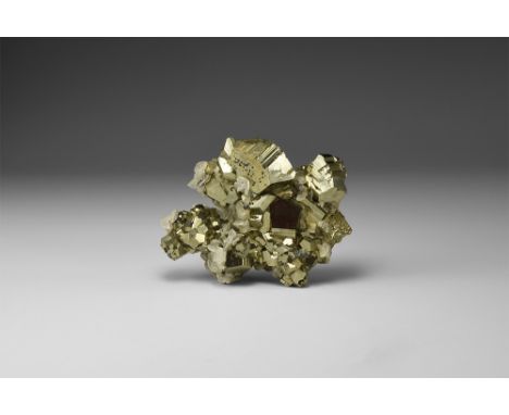 A cluster of fine, lustrous pyrite crystals form the classic Peruvian locality, crystallising principally as pyritohedrons, w