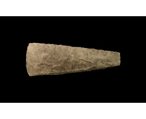 Neolithic, 4th-2nd millennium BC. A flint axehead, rectangular in section with tapering blade and gently curved edge, square 