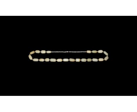 20th century AD. A necklace comprising twenty-two jade tabular beads with crystal glass spacers, screw closure.  76 grams, 60