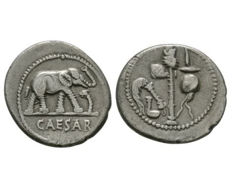 49-48 BC. Rome mint. Obv: CAESAR legend beneath elephant walking right about to trample on a serpent. Rev: sacrificial implem
