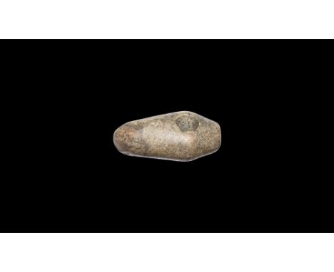 Neolithic, 5th-3rd millennium BC. A polished diorite axe-hammer with keeled upper face, rounded edge, round-section hammer-fa