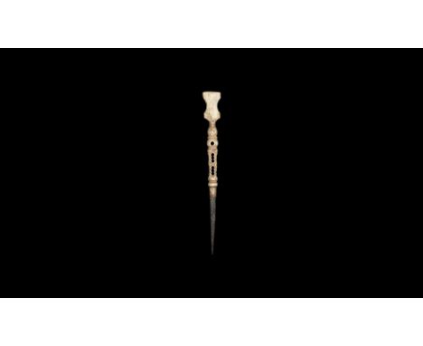 1st-3rd century AD. A round-section iron spike in a turned bone balustered handle with openwork section, lyre-shaped erasing 