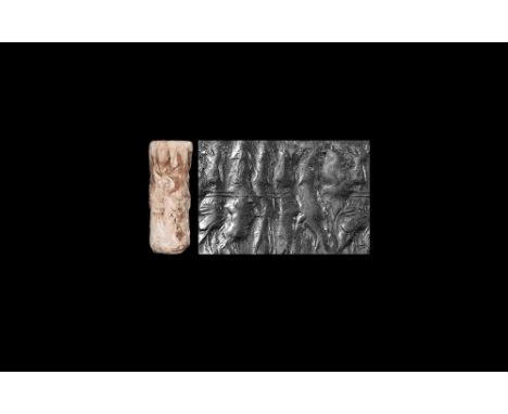 23rd century BC. A carved shell cylinder seal with two rows, each depicting a different scene with human and animal figures; 