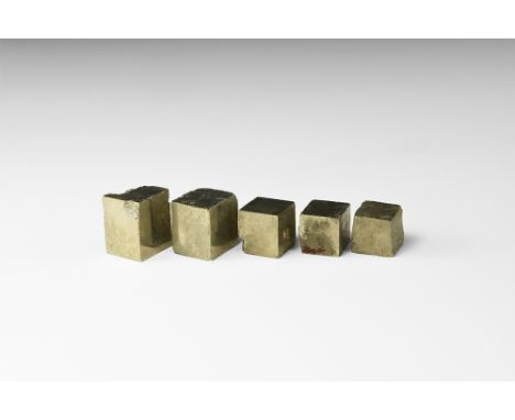A group of five pyrite (fool's gold) cubes, in white card tray. See Bonewitz, Dr. Ronald Louis, Rocks & Minerals, 2008, p.137