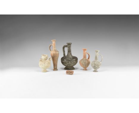 1st millennium BC-1st millennium AD. A mixed ceramic group comprising: a black-burnished flask with twisted handle, palmettes