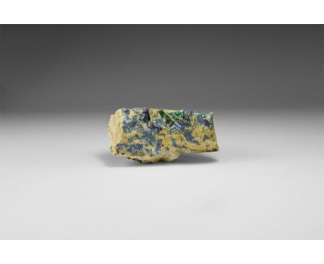 A matrix specimen with numerous areas of azurite, and uniquely, needle-like sprays of malachite, in white card tray with adhe