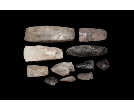 Neolithic, 4th-2nd millennium BC. A mixed group of stone implements comprising: a large and a smaller square-section axe-hamm