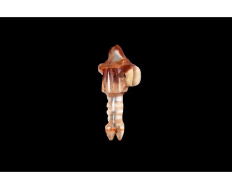 New Kingdom, 1550-1070 BC. A carved agate(?) amuletic pendant of two feathers (pesesh kef), pierced lug to the reverse. Cf. A