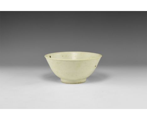 19th century AD. A tin-glazed bowl with deep basal ring and flared rim.  378 grams, 15.5cm (6 1/4"). From an important London