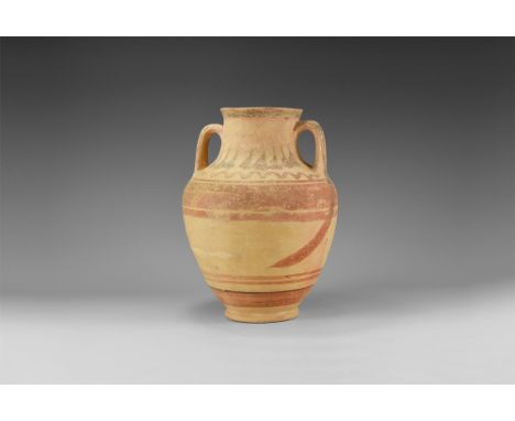 Late 1st millennium BC. A ceramic jar with basal ring, barrel-shaped body, broad shoulder, neck with chamfered rim, two D-sec