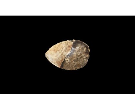 Middle Palaeolithic, 300,000-30,000 BP. A finely knapped hand axe with twist in cross-section; the flint grey in colour with 