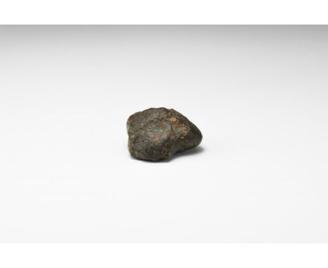A brown meteorite from an unidentified locality, probably an L-chondrite, based on its relatively light weight and ablation c