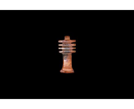 New Kingdom, 1550-1070 BC. A carved carnelian amuletic pendant of the djed pillar with loop suspension. Cf. Andrews, C. Amule