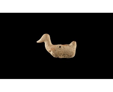 8th-6th century BC. A ceramic whistle formed as a bird, possibly a duck, with prominent curved beak and raised 'tail'; four h