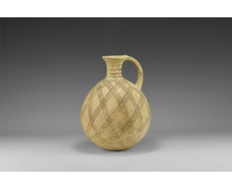 2nd millennium BC. A globular ceramic vessel with slender neck, everted rim, strap handle; bands of black painted hatching to