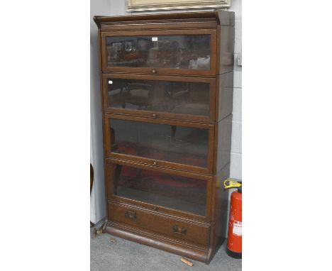 A 1930s Globe Wernike Style Oak Sectional Bookcase, four tier, 87cm by 36cm by 162cm