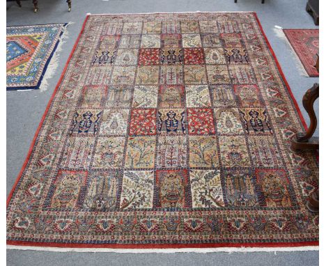 Indian Carpet of Garden Design, the polychrome field of plants and Mihrabs enclosed by similar borders, 306cm by 200cmIn good
