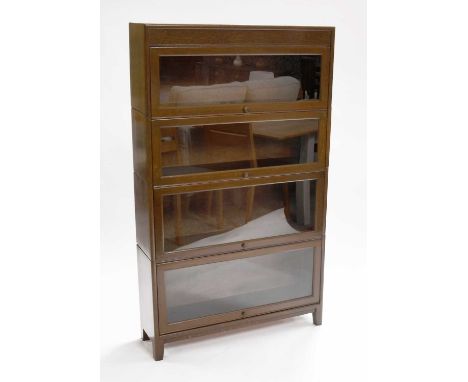 A 1930s Globe Wernicke Style Four Tier Oak Stacking Bookcase, 87cm by 25cm by 146cm