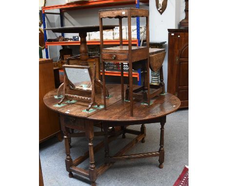An Early 18th Century Oak Gate Leg Table, 150cm by 116cm by 73cm, together with a George III oak tripod table with circular t