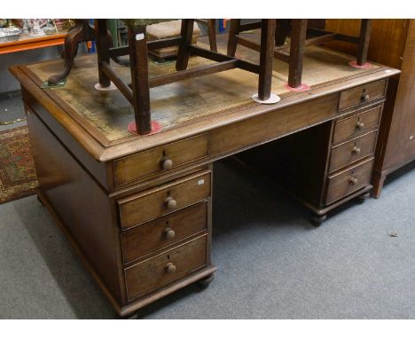 A Victorian Mahogany Leather Inset Desk; 153cm by 107cm by 77cm, together with a George III Mahogany straight fronted chest o