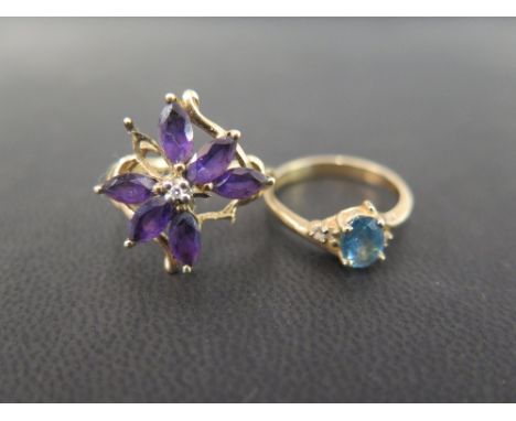 A 9ct gold blue and white-gem dress ring - Believed to be topaz - Hallmarked London - Ring size N - Together with a 9ct gold 