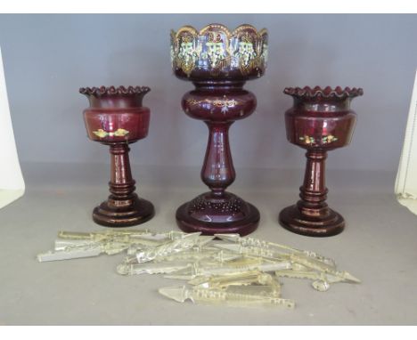 A Victorian Bohemian red glass lustre, the bowl decorated with gilt and enamel design with gilded edge, body having two rows 