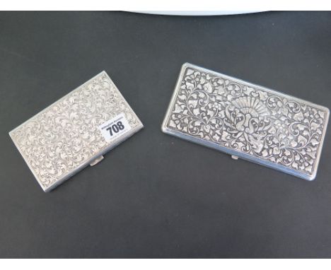 Two large Continental silver cigarette cases - both with heavily embossed decoration, one stamped 800, the second larger case