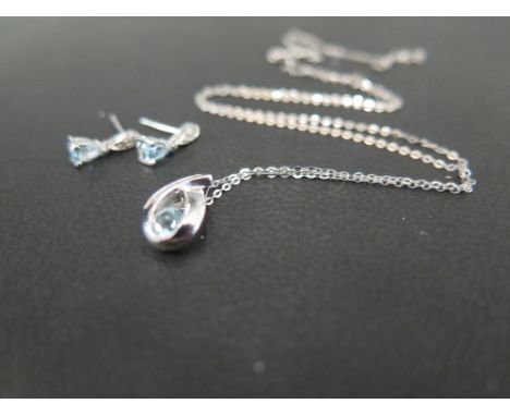 A blue-gem and diamond pendant - Suspended from a belcher-link chain - Length of pendant 1.2cms - Length of chain 46cms - Cha