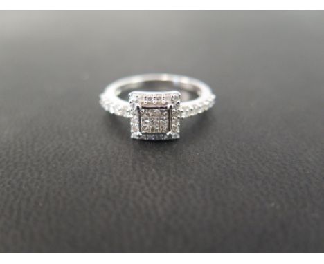 A 9ct gold diamond square-shape cluster ring - The princess-cut diamond square-shape panel, within a brilliant-cut diamond su