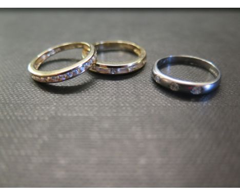 Three cubic zirconia band rings - To include two set in 14ct - Hallmarked Birmingham - Ring size L - Weight approx 4.9gms - T