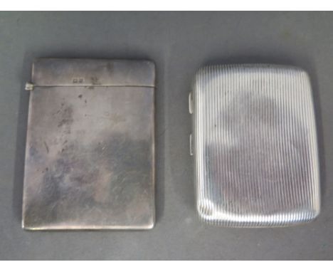 A silver hallmarked card case - mark for Birmingham 1919 and a silver hallmarked cigarette case - Birmingham 1910 - Weight ap