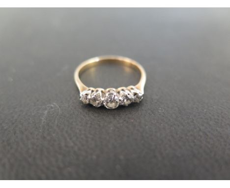 A diamond graduated five-stone ring - Tests as gold - Ring size M 1/2 - Weight approx 2.0gms
Condition Report: Good - With li