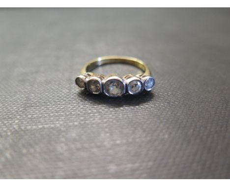 A diamond five-stone ring - The old-cut diamonds within a rubover setting to the plain half band - Estimated total diamond we