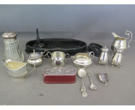 An assorted lot of hallmarked silver - including peppers, mustard, sugar sifter, small jugs and spoons with silver hallmarked