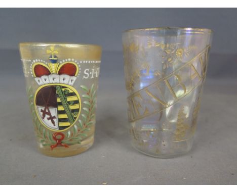 A late 17th century drinking glass with enamelled decoration including a coat of arms dated 1683 - chip to top and wear to gi