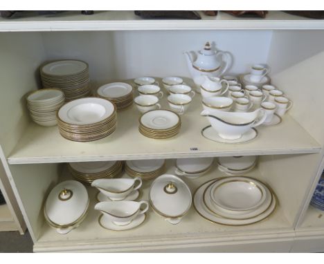 A large Royal Doulton Royal Gold dinner service comprising - 12 dinner plates, 26 side plates 12 small side plates, 12 soup b