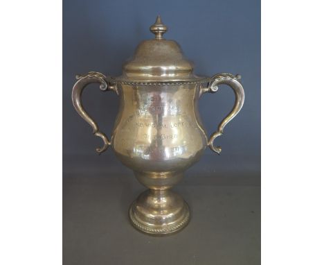 A large twin handled lidded silver trophy cup - Histon and District Homing Club - London 1910/11 maker R P - Height 38 cm - T