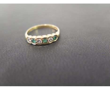 An 18ct gold emerald and diamond six-stone scalloped ring - Hallmarked London - Ring size P - Weight approx 2.7gms
Condition 