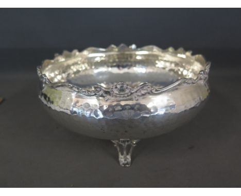 A large sterling silver three footed bowl with hammered decoration and a shaped foliate edge - Greek hallmarks and stamped 92