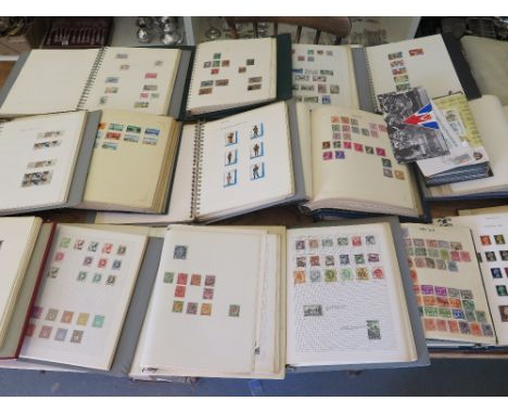 A large collection of World Stamps including British and Commonwealth  and approx. 60 First Day covers in 19 albums 