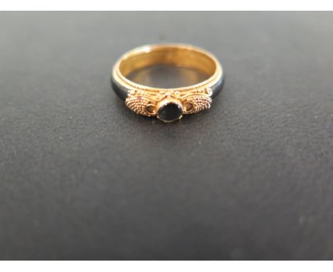 An enamel gem-set mourning ring - With bead and scroll detail - Stamped 22K - Ring size O 1/2 - Weight approx 1.5gms
Conditio