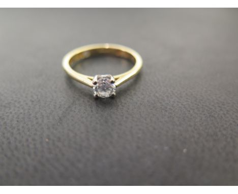 An 18ct gold 'ONE LOVE' brilliant-cut diamond single-stone ring - With diamond highlight to the inside of band - Hallmarked B