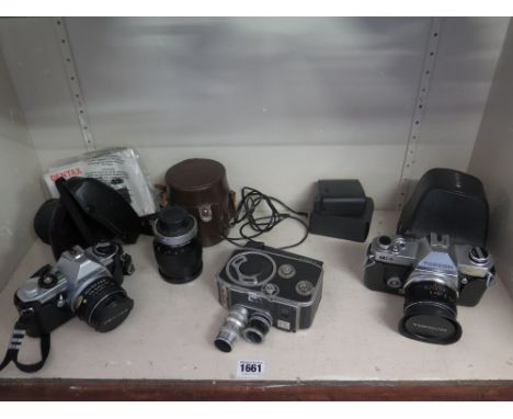 A selection of cameras to include a cased Topcon IC-1 auto with 50mm lens and additional cased 135mm lens - appears working -