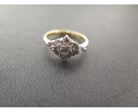 A diamond cluster ring - Set with brilliant-cut diamonds - Stamped 750 - Ring size J 1/2 - Weight approx 3.0gms
Condition Rep